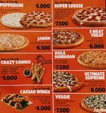 ¿Qué medida tiene una pizza pariente en Dóminos?